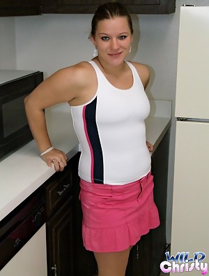 Ponytailed scrumptious teen beauty Christy showing her massive titties in the kitchen